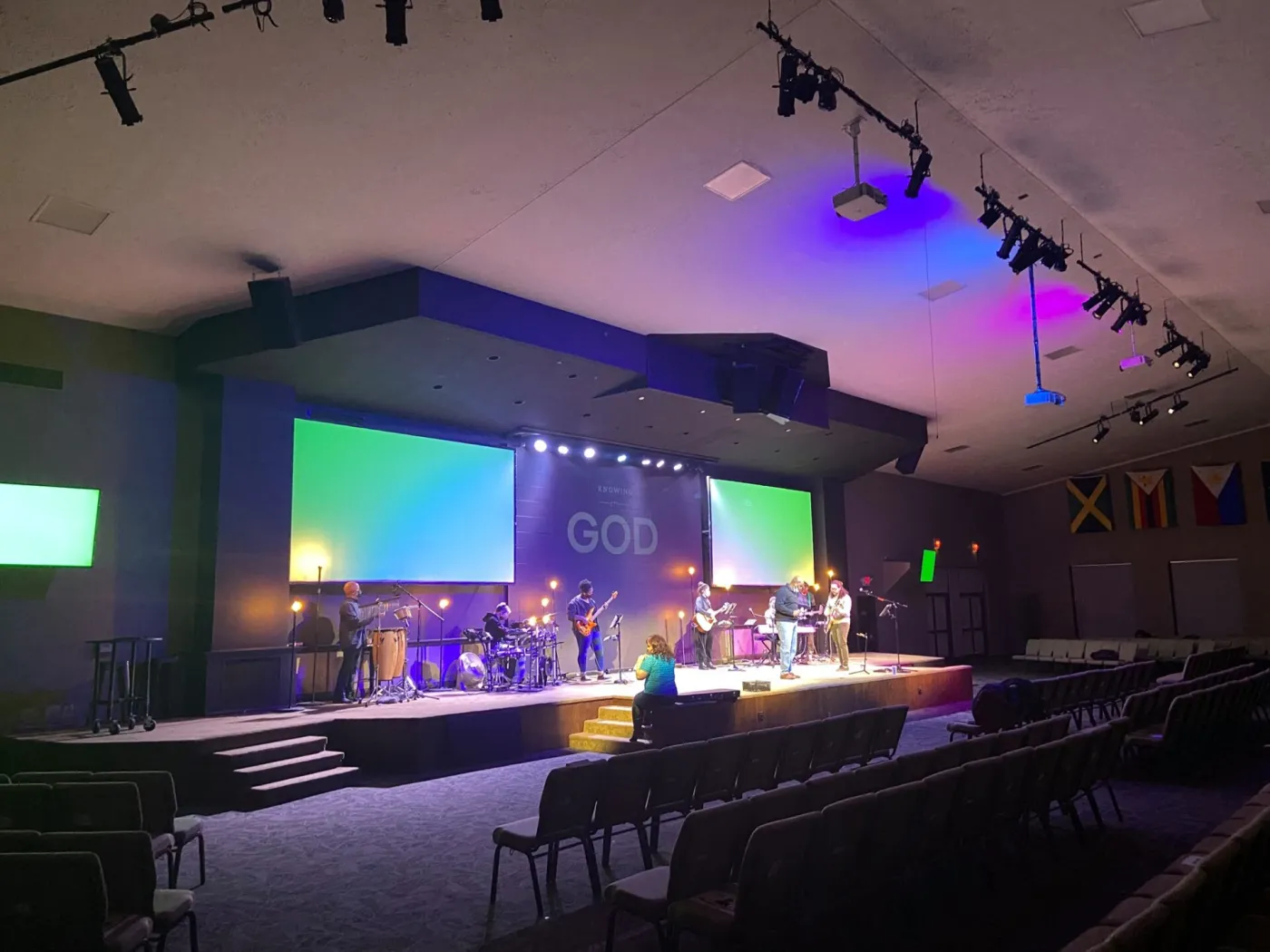 Worship stage with projection screens and stage lighting installed by Pinnacle Systems